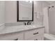 Clean bathroom featuring a vanity with marble countertop, sleek black hardware, and a shower-tub with white tile at 5808 18Th W St # A & B, Bradenton, FL 34207