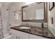 Updated bathroom featuring marble countertops, modern fixtures, and a shower at 5808 18Th W St # A & B, Bradenton, FL 34207