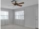 Bedroom featuring two windows with sheer curtains, neutral paint and a ceiling fan at 5808 18Th W St # A & B, Bradenton, FL 34207