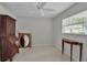 Spacious bedroom with a vintage desk, mirror, and window offering natural light at 5808 18Th W St # A & B, Bradenton, FL 34207