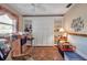 Cozy bedroom featuring a stylish murphy bed, built in shelving, and a ceiling fan at 5808 18Th W St # A & B, Bradenton, FL 34207