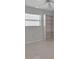 Bright bedroom with a ceiling fan, window with blinds, and a built-in bookshelf against the wall at 5808 18Th W St # A & B, Bradenton, FL 34207