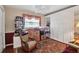 Bedroom featuring vintage rug, rocking chair and large window at 5808 18Th W St # A & B, Bradenton, FL 34207