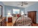 Inviting bedroom with light blue walls, hard wood flooring, and plenty of natural light at 5808 18Th W St # A & B, Bradenton, FL 34207