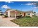 Charming single-story house with a covered carport and a welcoming red front door at 5808 18Th W St # A & B, Bradenton, FL 34207