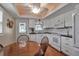 Inviting kitchen and dining area with white cabinetry, modern appliances, and natural light at 5808 18Th W St # A & B, Bradenton, FL 34207