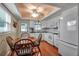 Bright kitchen with white cabinets, modern appliances, and adjacent dining area at 5808 18Th W St # A & B, Bradenton, FL 34207