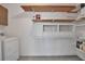 Functional laundry room with built-in shelving, cabinetry, and storage space at 5808 18Th W St # A & B, Bradenton, FL 34207