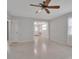 Bright living room with neutral paint and view into adjoining room at 5808 18Th W St # A & B, Bradenton, FL 34207