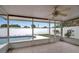 Enclosed patio looking out to the pool, tile floors, ceiling fan, and sliding glass windows at 5808 18Th W St # A & B, Bradenton, FL 34207