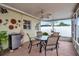 Relaxing screened-in patio with tiled floor, ceiling fan, and backyard at 5808 18Th W St # A & B, Bradenton, FL 34207