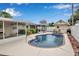 Inviting backyard pool featuring a spa and lush landscaping, perfect for relaxation and entertaining at 5808 18Th W St # A & B, Bradenton, FL 34207