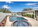 Backyard oasis featuring a sparkling pool with spa, surrounded by a well-maintained yard at 5808 18Th W St # A & B, Bradenton, FL 34207