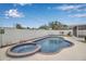 Backyard oasis featuring a sparkling pool with spa, surrounded by a well-maintained yard at 5808 18Th W St # A & B, Bradenton, FL 34207