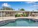 Inviting backyard pool featuring a spa and lush landscaping, perfect for relaxation and entertaining at 5808 18Th W St # A & B, Bradenton, FL 34207
