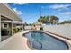 Backyard oasis featuring a sparkling pool with spa, surrounded by a well-maintained yard at 5808 18Th W St # A & B, Bradenton, FL 34207
