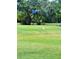 Lush golf course with blue flag and wading bird offering a serene and picturesque setting at 6012 Oak Creek Ln # 1913, Bradenton, FL 34210