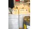 Functional laundry area includes washer, dryer, and storage, making laundry day a breeze at 6012 Oak Creek Ln # 1913, Bradenton, FL 34210