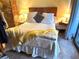 Comfortable main bedroom with a queen-sized bed, bedside tables with lamps and decor at 6012 Oak Creek Ln # 1913, Bradenton, FL 34210