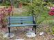 Bench at Chick's Corner, with lush landscaping at 6012 Oak Creek Ln # 1913, Bradenton, FL 34210