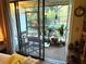 Enclosed porch area with patio seating, plants and a ceiling fan, offering a relaxing outdoor space at 6012 Oak Creek Ln # 1913, Bradenton, FL 34210