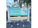 Timber Creek Condominiums sign with blue heron logo, highlighting the community's golf course at 6012 Oak Creek Ln # 1913, Bradenton, FL 34210