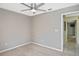 Bedroom featuring neutral walls, carpeting, and a doorway leading to the hallway at 6023 Mayberry Ave, North Port, FL 34287
