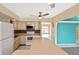 Bright kitchen with stainless steel appliances, tile backsplash, and a large island at 6023 Mayberry Ave, North Port, FL 34287