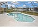 Sparkling screened-in pool with a relaxing hot tub, perfect for outdoor enjoyment at 6023 Mayberry Ave, North Port, FL 34287