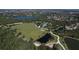 Scenic aerial view showcasing the community's ponds, pool, green spaces, walking path and lush landscaping at 6357 Royal Tern Cir, Lakewood Ranch, FL 34202