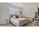 Comfortable bedroom featuring a bed, sofa, and natural light from window at 6357 Royal Tern Cir, Lakewood Ranch, FL 34202