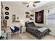 Eclectic bedroom with a desk, shelving, and bed with a decorative throw at 6357 Royal Tern Cir, Lakewood Ranch, FL 34202
