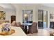 Cozy dining area features a chandelier and views of the pool area at 6357 Royal Tern Cir, Lakewood Ranch, FL 34202