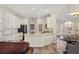 Bright, modern kitchen featuring white cabinetry, stainless steel appliances and stone countertops at 6357 Royal Tern Cir, Lakewood Ranch, FL 34202