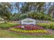 The sign for Greenbrook Village, a beautiful community filled with lush landscaping at 6357 Royal Tern Cir, Lakewood Ranch, FL 34202