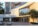 Modern building exterior with sleek architectural lines and porte-cochere at 688 Golden Gate Point # 302, Sarasota, FL 34236