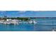 Waterfront property with marina views of boats, yachts, and other homes on the water at 688 Golden Gate Point # 302, Sarasota, FL 34236