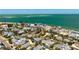 Coastal community home with a backyard pool offers serene oasis among palm trees and beautiful neighborhood at 709 N Bay Blvd, Anna Maria, FL 34216