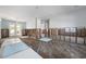Spacious living room undergoing renovation with exposed framing and original hardwood floors at 709 N Bay Blvd, Anna Maria, FL 34216
