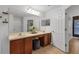 Spacious bathroom featuring double sinks, vanity area, and natural light at 7135 Royal George Ct, Wesley Chapel, FL 33545