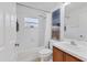 Clean bathroom featuring a shower-tub combo, a modern toilet, and a well-lit vanity at 7135 Royal George Ct, Wesley Chapel, FL 33545