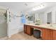 Spacious bathroom with double sinks, vanity area, large tub and separate glass enclosed shower at 7135 Royal George Ct, Wesley Chapel, FL 33545