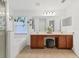 Large bathroom featuring double sinks, vanity area, soaking tub, and a separate door to the toilet at 7135 Royal George Ct, Wesley Chapel, FL 33545