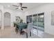 Bright dining room featuring dining table and sliding glass door to the outside patio at 7135 Royal George Ct, Wesley Chapel, FL 33545