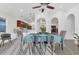 Bright dining room featuring ceiling fan, dining table, and open view to the kitchen at 7135 Royal George Ct, Wesley Chapel, FL 33545