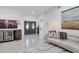 Spacious foyer with double doors, unique barrel wine bar, light tile floor, and art at 7135 Royal George Ct, Wesley Chapel, FL 33545