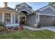 Inviting double doors, a well manicured front yard and attached garage add beauty at 7135 Royal George Ct, Wesley Chapel, FL 33545