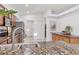 Kitchen featuring granite counters, stainless appliances, and tile flooring at 7135 Royal George Ct, Wesley Chapel, FL 33545