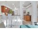 Kitchen with bar seating leading to dining area and stainless steel appliances at 7135 Royal George Ct, Wesley Chapel, FL 33545
