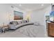 Open living space with modern decor, tile flooring and a view of the double front doors at 7135 Royal George Ct, Wesley Chapel, FL 33545